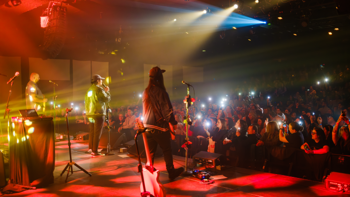 Rita Mae performing on stage at the Lighthouse Arts Centre.